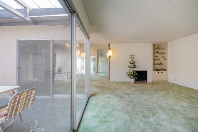 999 E Valley Blvd Unit 44, Alhambra, CA 91801 - interior space featuring carpet, a textured ceiling, built in shelves, and a fireplace