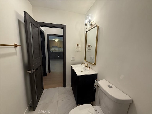 960 Larrabee St Unit 120, West Hollywood, CA 90069 - half bath featuring marble finish flooring, vanity, and toilet