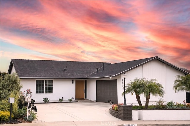 26492 Jacinto Dr, Mission Viejo, CA 92692 - view of front of house featuring an attached garage, driveway, roof with shingles, and stucco siding