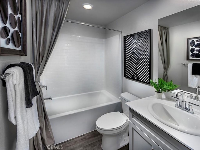 217 Aurora Ln, Pomona, CA 91767 - bathroom featuring recessed lighting, shower / bath combination with curtain, wood finished floors, toilet, and vanity