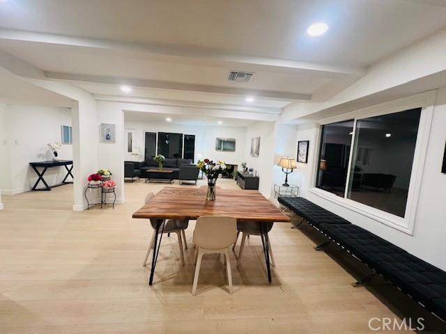 dining space featuring visible vents, beamed ceiling, light wood finished floors, and recessed lighting
