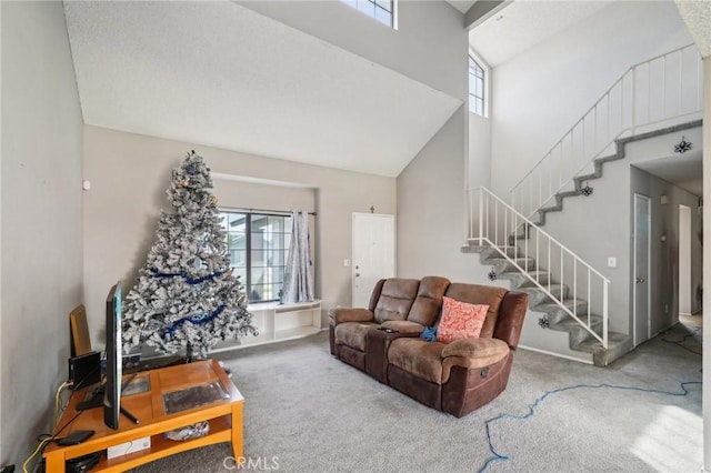 447 Westminister Dr, San Jacinto, CA 92583 - living room featuring a towering ceiling, carpet, and stairs