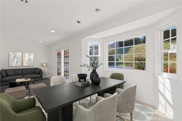 dining area featuring plenty of natural light, baseboards, crown molding, and recessed lighting