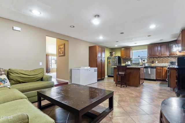 1421 E Abbottson St, Carson, CA 90746 - living area featuring light tile patterned floors and recessed lighting