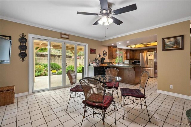 1943 Belmore Ct, El Cajon, CA 92020 - dining space with crown molding, baseboards, ceiling fan, and light tile patterned flooring