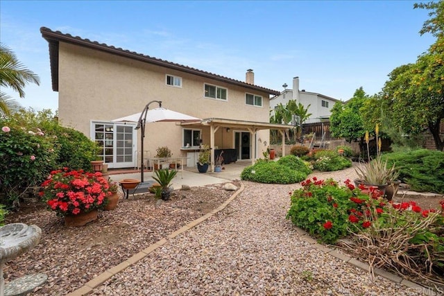 1943 Belmore Ct, El Cajon, CA 92020 - rear view of house featuring a patio area, stucco siding, a chimney, and fence