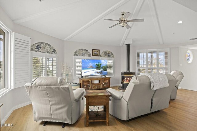 5270 W Wooley Rd, Oxnard, CA 93035 - living area with a wood stove, plenty of natural light, ceiling fan, and light wood-style flooring