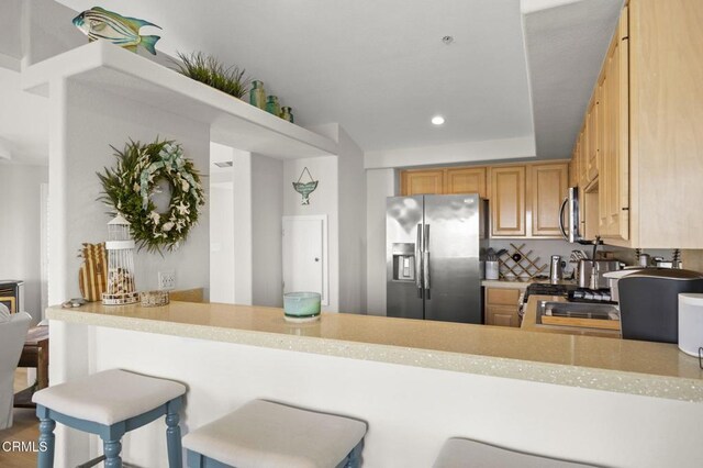 5270 W Wooley Rd, Oxnard, CA 93035 - kitchen featuring appliances with stainless steel finishes, a peninsula, recessed lighting, and light countertops