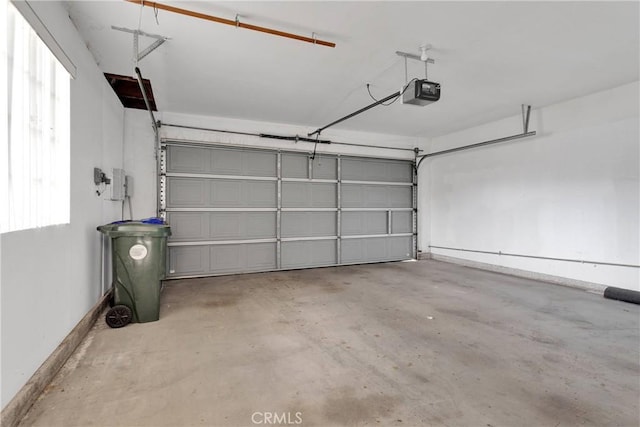 garage featuring a garage door opener