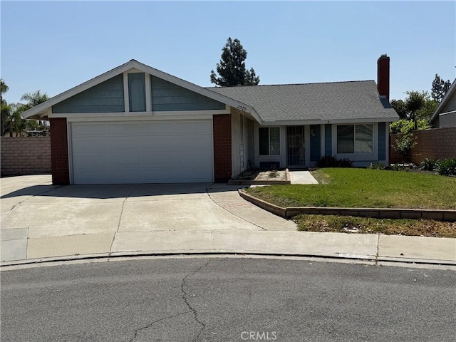 single story home featuring a garage, driveway, a front yard, and fence