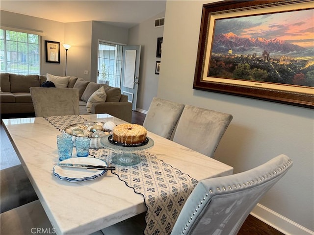 2579 Oak Springs Pl, Ontario, CA 91761 - dining area with baseboards, dark wood-type flooring, and vaulted ceiling
