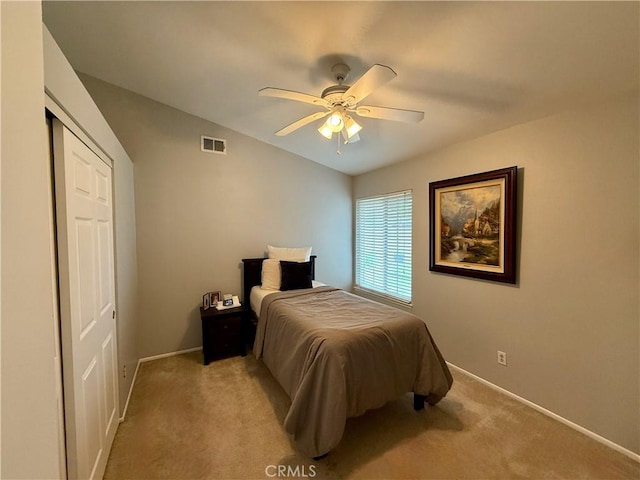 2579 Oak Springs Pl, Ontario, CA 91761 - bedroom with baseboards, light colored carpet, lofted ceiling, a ceiling fan, and a closet