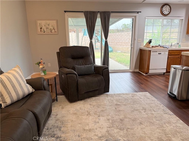 2579 Oak Springs Pl, Ontario, CA 91761 - living area featuring dark wood-style floors and healthy amount of natural light