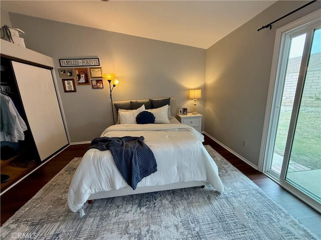 2579 Oak Springs Pl, Ontario, CA 91761 - bedroom with access to exterior, wood finished floors, and baseboards