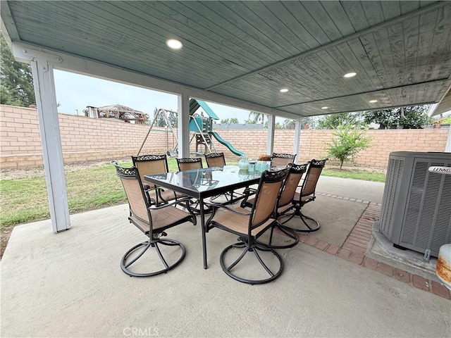 2579 Oak Springs Pl, Ontario, CA 91761 - fenced backyard with outdoor dining area, central AC, a patio, and a playground
