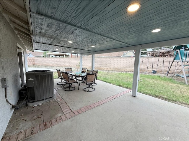 2579 Oak Springs Pl, Ontario, CA 91761 - view of patio featuring cooling unit, outdoor dining area, and a playground