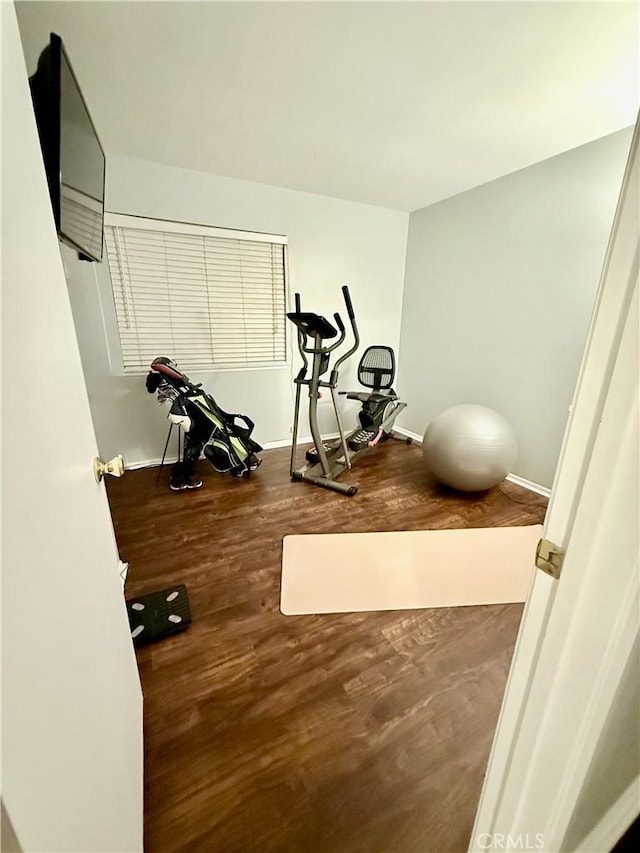 2579 Oak Springs Pl, Ontario, CA 91761 - workout area featuring wood finished floors and baseboards