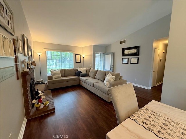 2579 Oak Springs Pl, Ontario, CA 91761 - living area featuring dark wood-style floors, baseboards, and vaulted ceiling