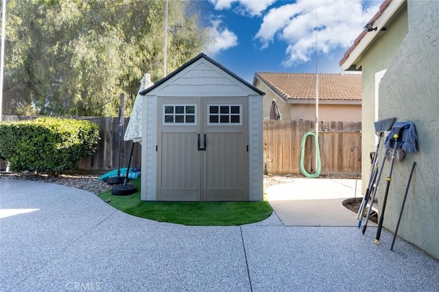 view of shed featuring a fenced backyard