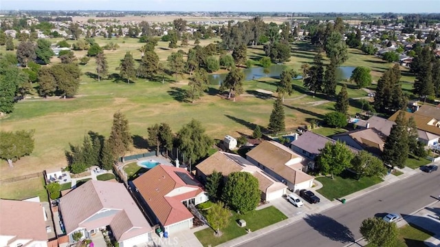 drone / aerial view with a residential view and a water view