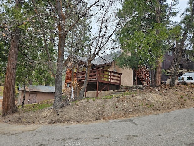 32868 Deer Ln, Running Springs, CA 92382 - view of front of home with a deck and stairway