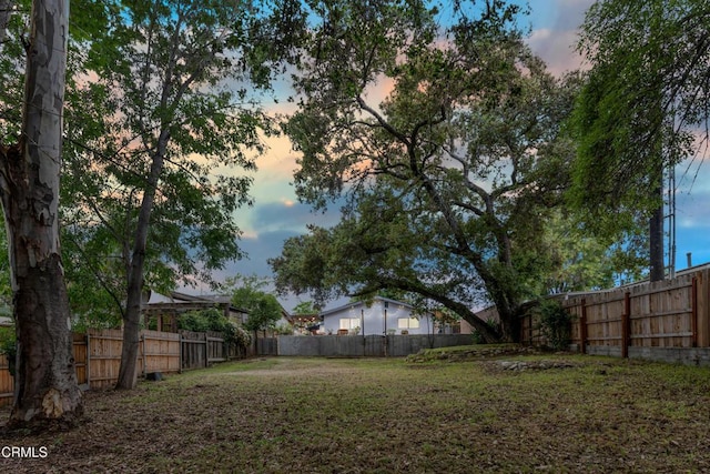 232 Prospect St, Oak View, CA 93022 - yard at dusk with a fenced backyard