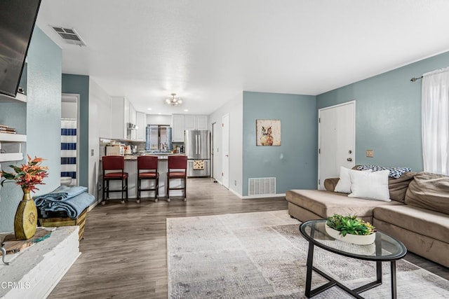 232 Prospect St, Oak View, CA 93022 - living room with wood finished floors, baseboards, and recessed lighting
