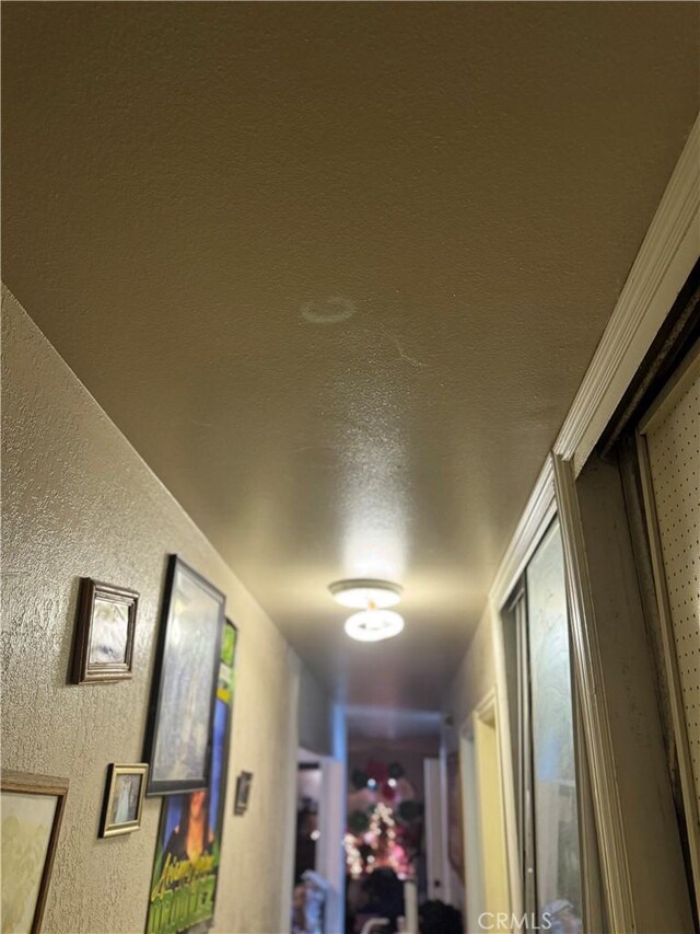 1017 N Alice Ave, Rialto, CA 92376 - hallway featuring a textured wall