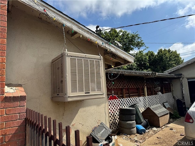 1017 N Alice Ave, Rialto, CA 92376 - view of side of home with stucco siding and cooling unit