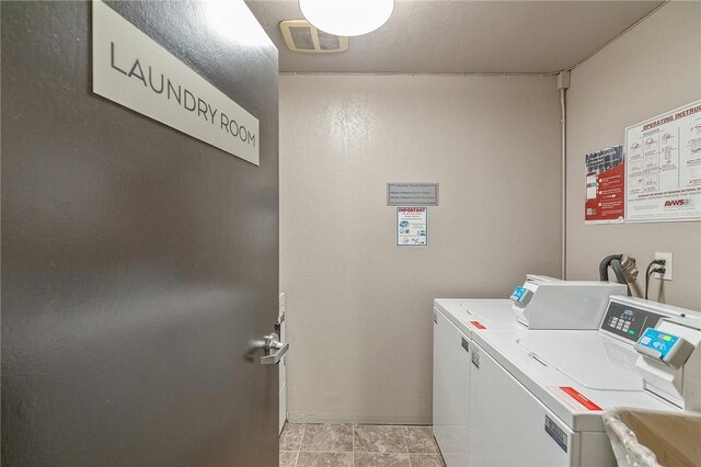 740 N Kings Rd Unit 225, West Hollywood, CA 90069 - community laundry room with washing machine and dryer and light tile patterned flooring
