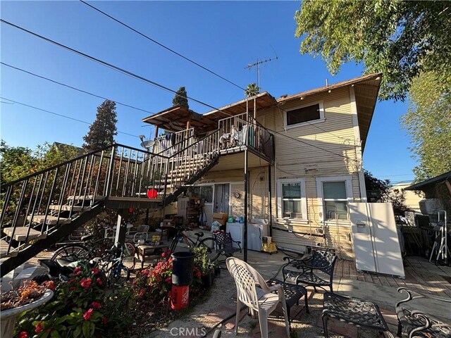 3852 4th St, Riverside, CA 92501 - rear view of house with a patio area and stairs