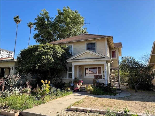 3852 4th St, Riverside, CA 92501 - american foursquare style home with a porch and stairway