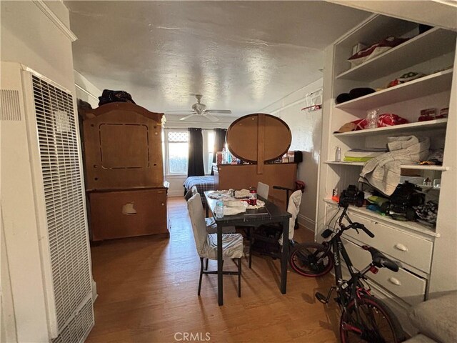 3852 4th St, Riverside, CA 92501 - dining room with a ceiling fan, wood finished floors, and a heating unit