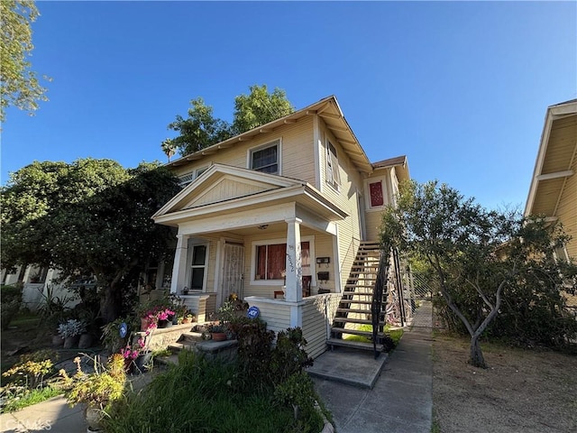 3852 4th St, Riverside, CA 92501 - traditional-style home featuring stairs and covered porch