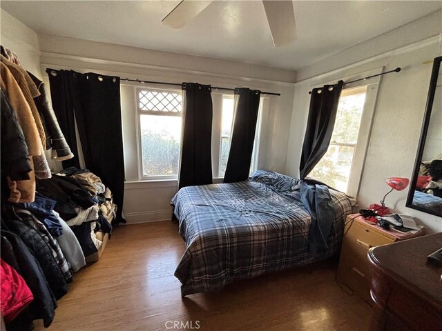 3852 4th St, Riverside, CA 92501 - bedroom with ceiling fan, baseboards, and wood finished floors