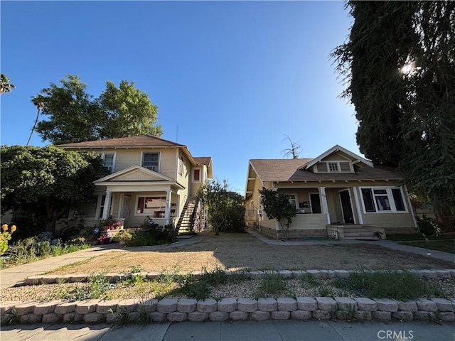 3852 4th St, Riverside, CA 92501 - bungalow-style home featuring stairway and a porch