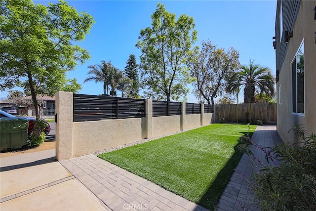 7443 Troost Ave, North Hollywood, CA 91605 - view of yard featuring a patio and a fenced backyard