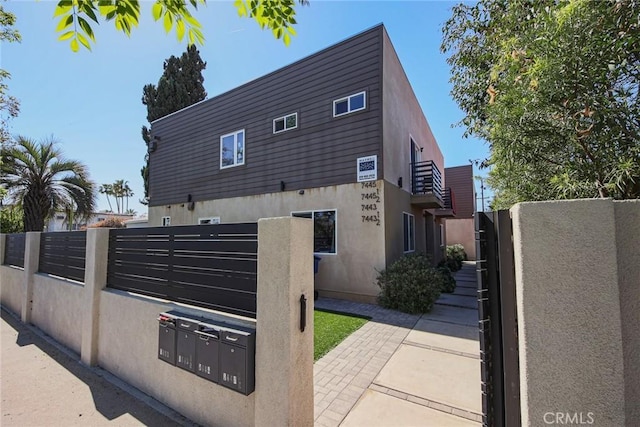 7443 Troost Ave, North Hollywood, CA 91605 - view of side of property with stucco siding and fence