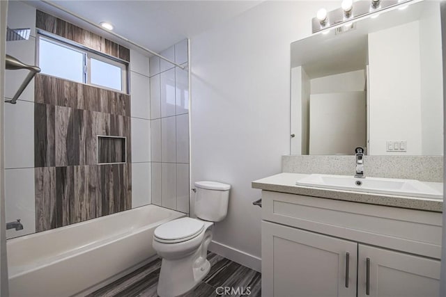 7443 Troost Ave, North Hollywood, CA 91605 - bathroom with wood finished floors, vanity, baseboards, toilet, and shower / bathtub combination