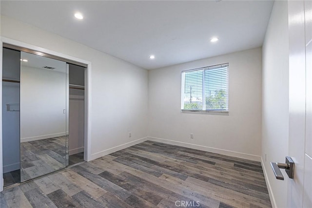 7443 Troost Ave, North Hollywood, CA 91605 - unfurnished bedroom featuring baseboards, wood finished floors, and recessed lighting