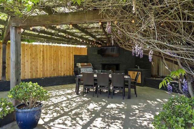 view of patio featuring a pergola, outdoor dining space, area for grilling, and fence