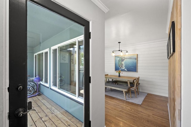interior space featuring wood walls and wood finished floors