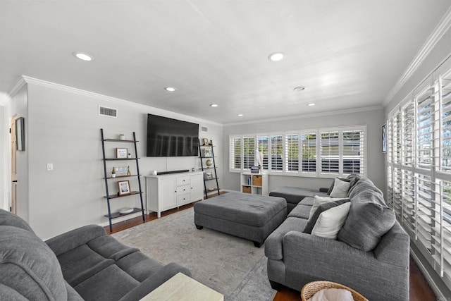 living room featuring ornamental molding, dark wood-style floors, and recessed lighting