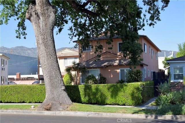 216 S Glenwood Pl, Burbank, CA 91506 - view of front of home featuring stucco siding and fence