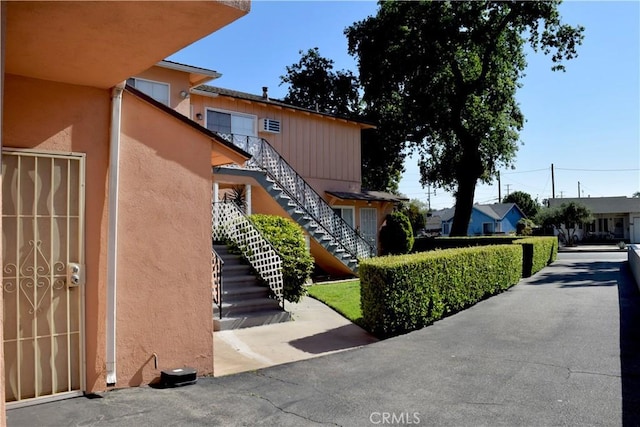 216 S Glenwood Pl, Burbank, CA 91506 - view of front of property featuring stucco siding and stairway