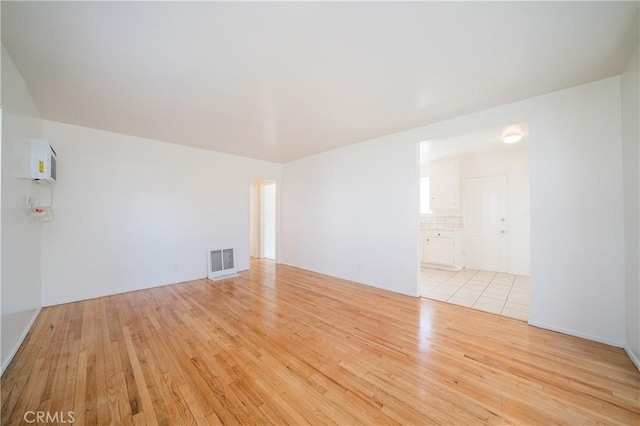 216 S Glenwood Pl, Burbank, CA 91506 - unfurnished room featuring visible vents and light wood-type flooring
