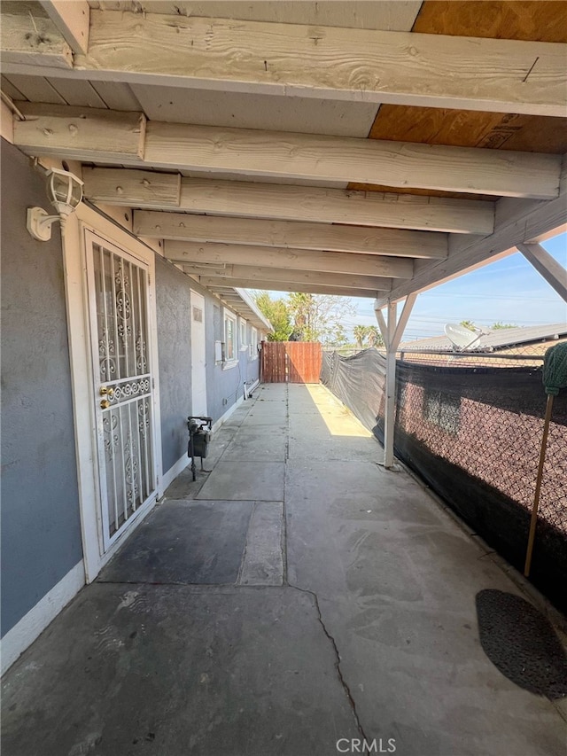 view of patio / terrace featuring fence