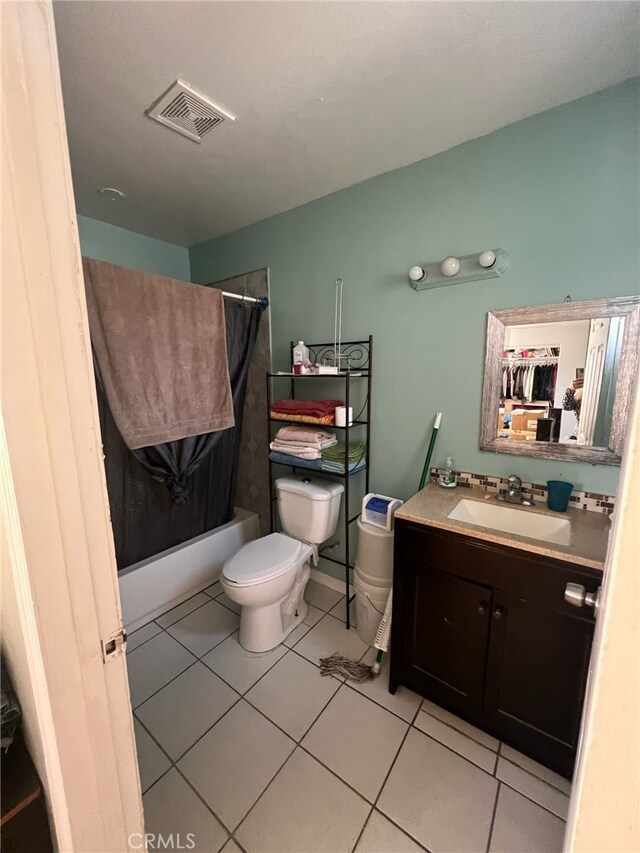 full bathroom featuring shower / bathtub combination with curtain, vanity, toilet, visible vents, and tile patterned flooring