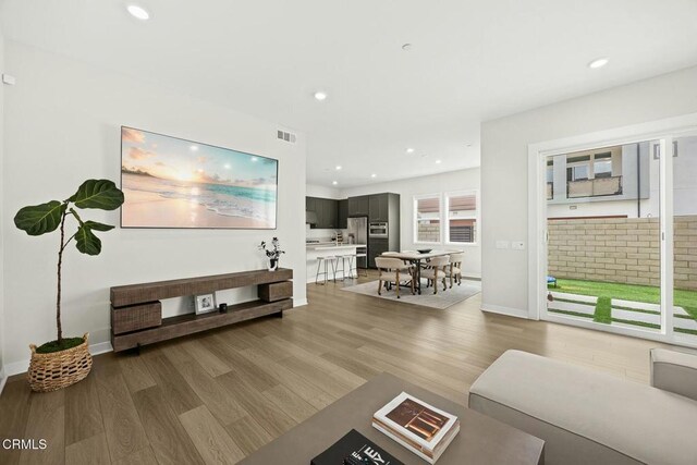 26945 Nature View Pl, Valencia, CA 91381 - living area featuring light wood-type flooring, recessed lighting, and baseboards