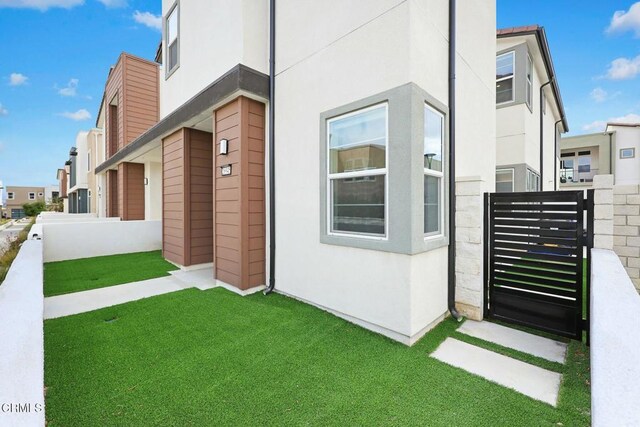 26945 Nature View Pl, Valencia, CA 91381 - view of front of property featuring stucco siding and a gate